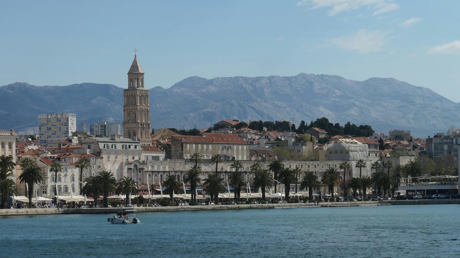 Picturesque cityscape of Split, Croatia, featuring the historic bell tower against a mountain backdrop.