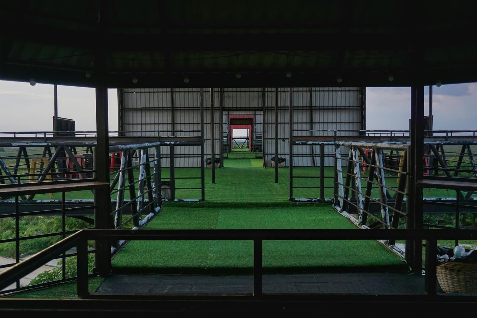 Explore a contemporary outdoor cafe setting with lush green scenery and creative architecture near Phnom Penh.