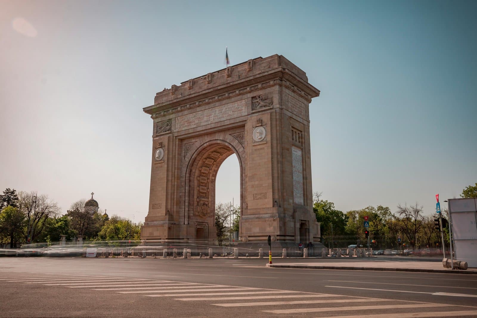 Stunning view of the Arch of Triumph, Bucharest, under clear skies.