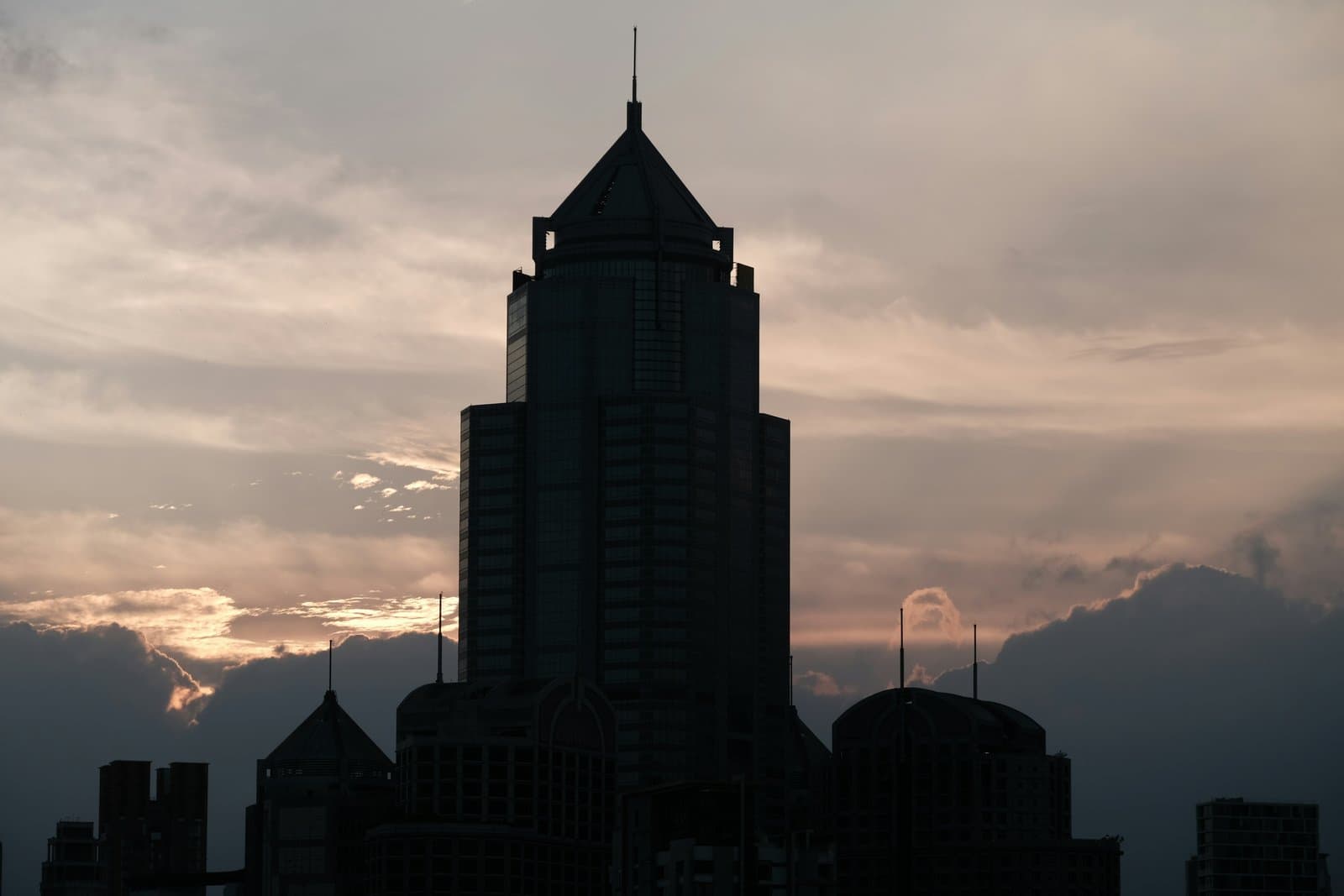 a very tall building with a clock on it's side
